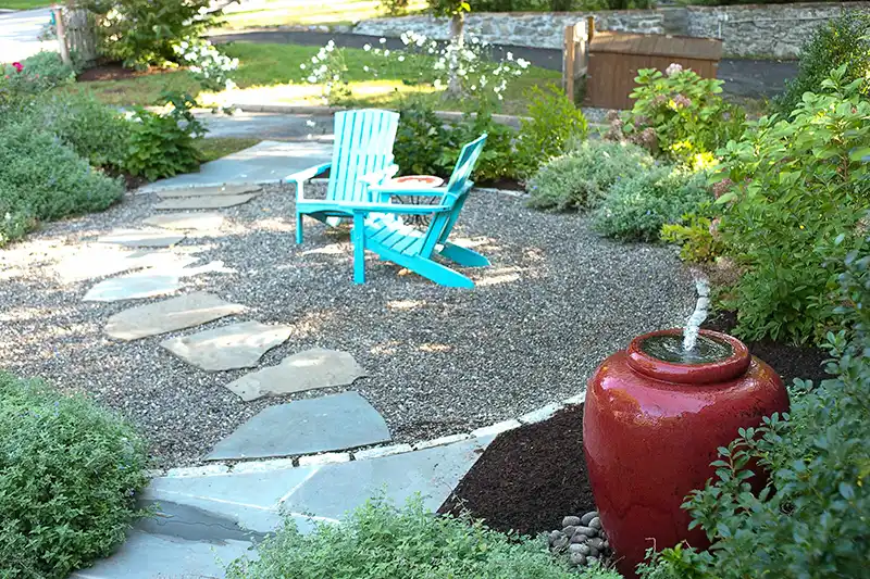 garden nook & flower bed accent of adirondack chairs